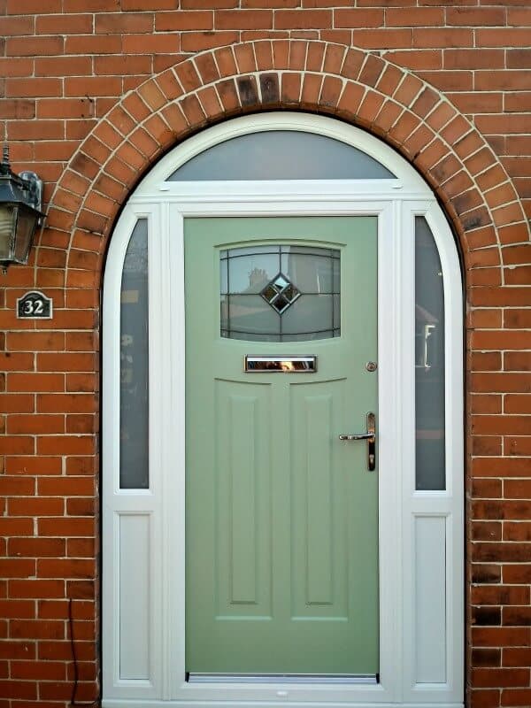 green rock door with white frame
