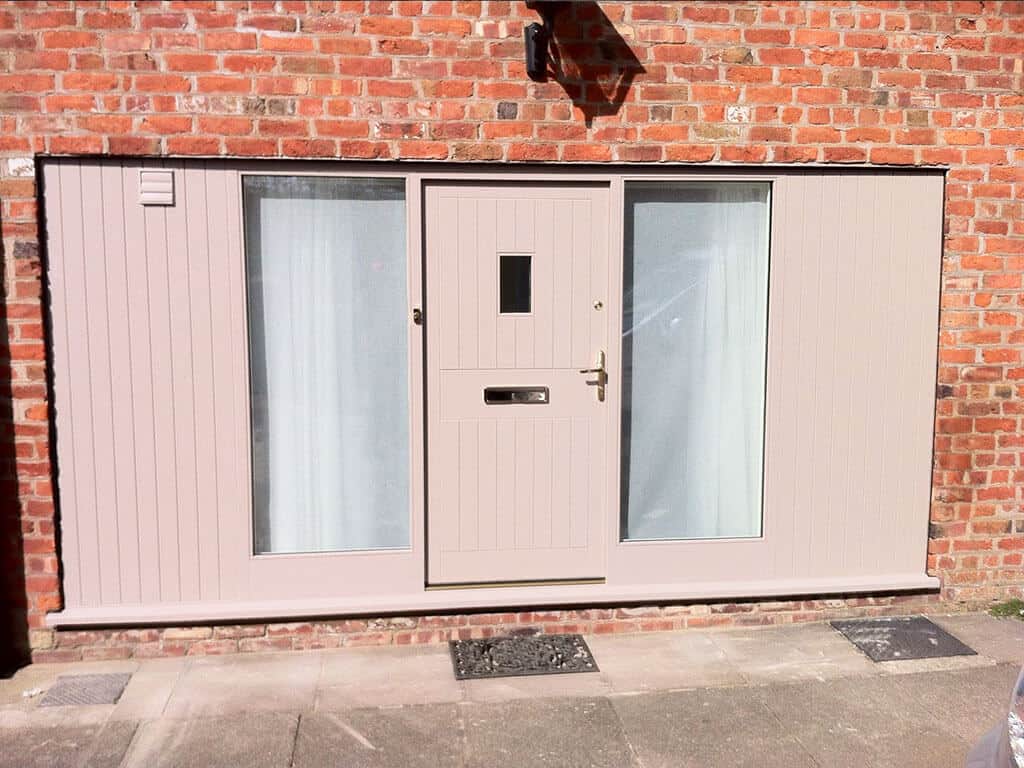 Pink accoya wood door with side panels