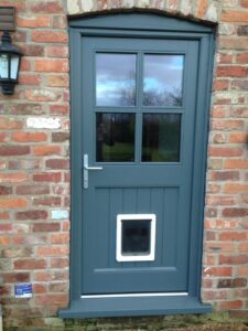 Timber door with catflap