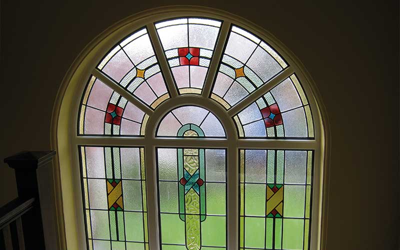 Arch Accoya wood window with leaded lights