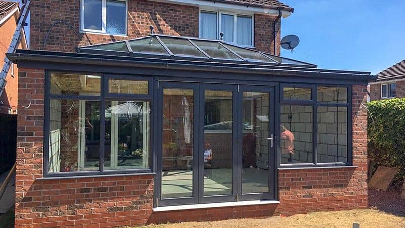 Black uPVC orangery with bifold doors