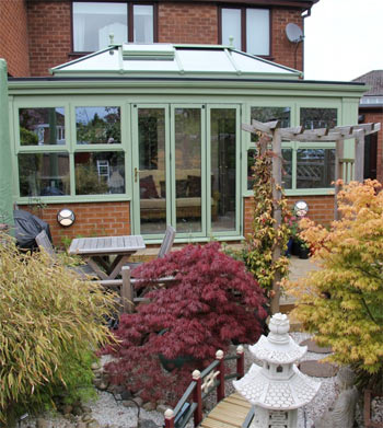 A timber orangery in traditional chartwell green