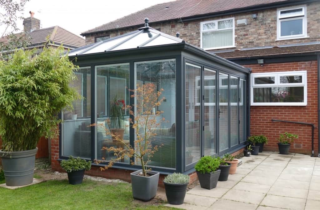 Grey glazed conservatory with integrated blinds