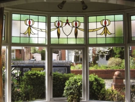 Stained glass windows with white Accoya wood frames by Reddish Joinery