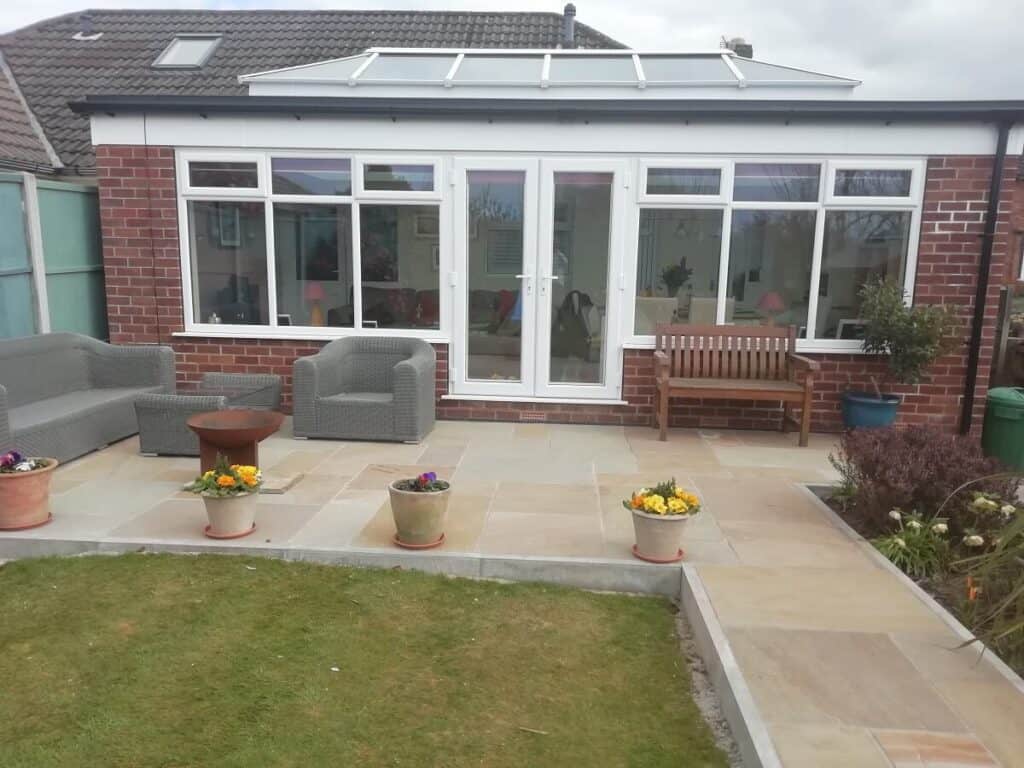 White bungalow orangery with French doors